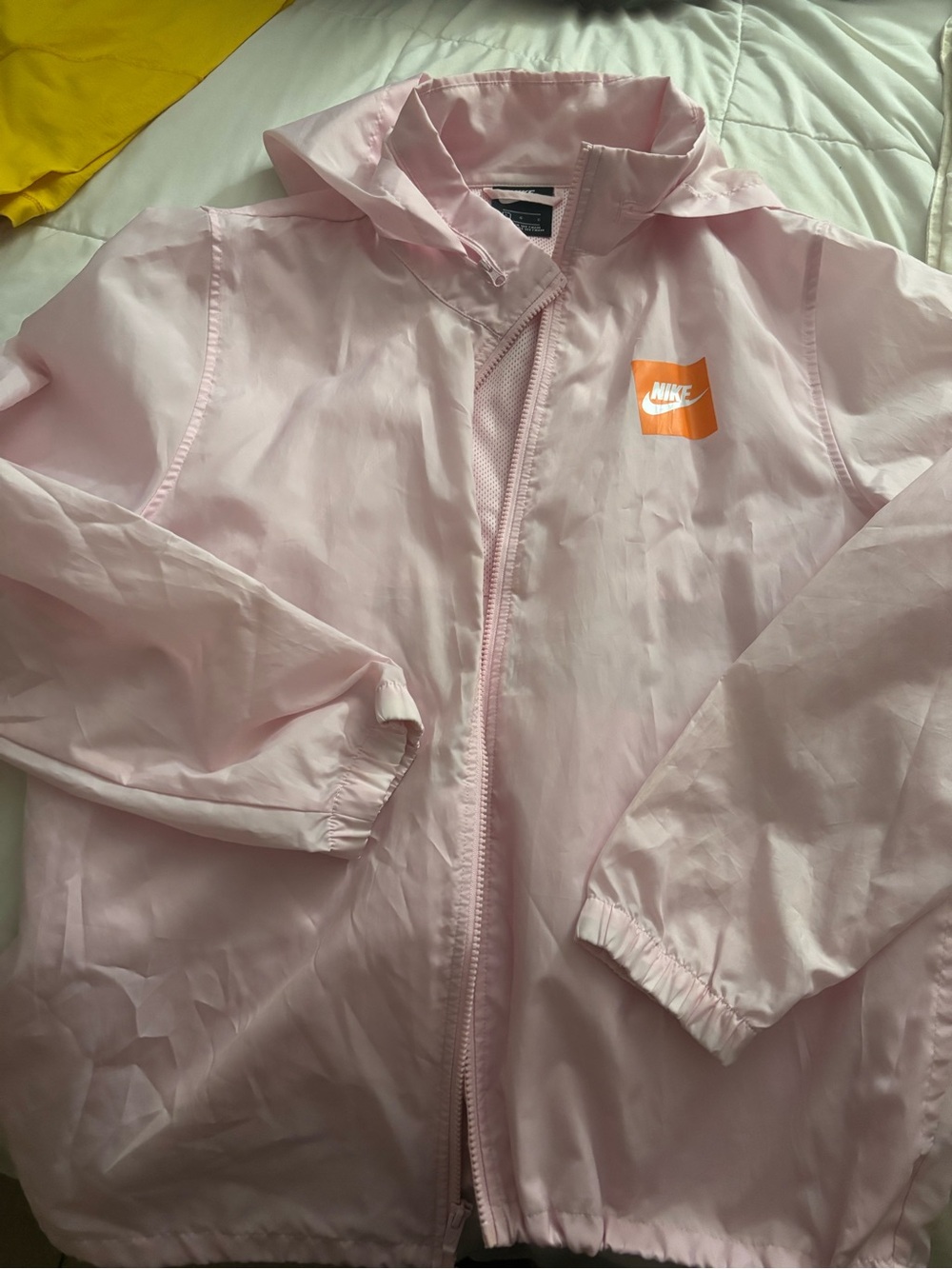 Nike women’s Light Pink Rain Jacket with Orange Logo